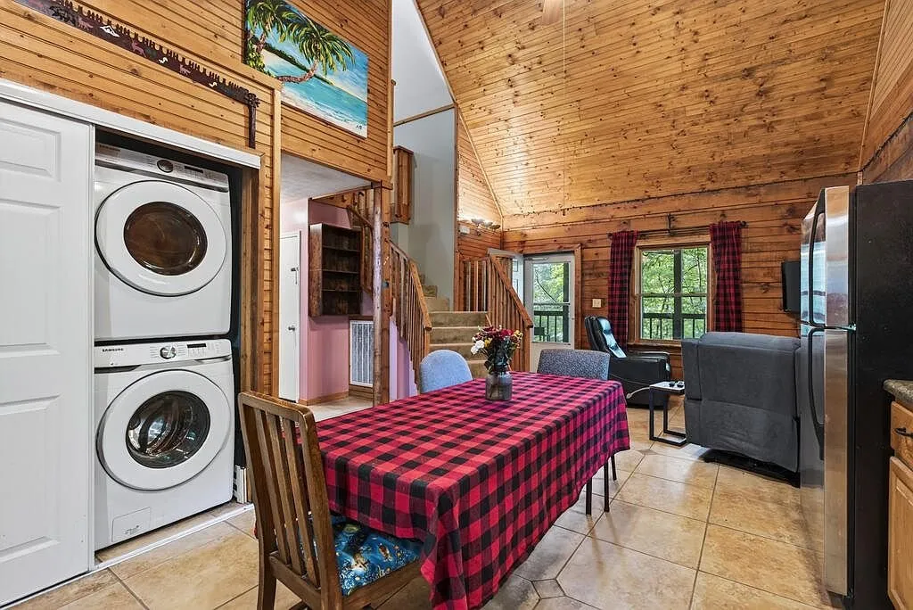 The vaulted living room with wood ceilings and an open floor plan