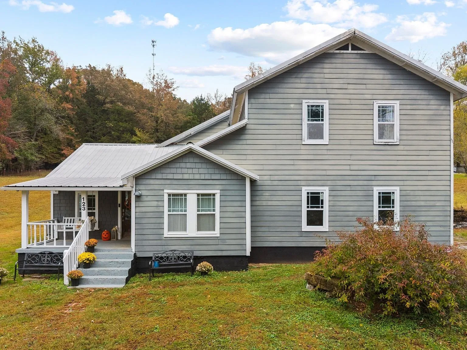 Front of the house with the covered porch and entry steps