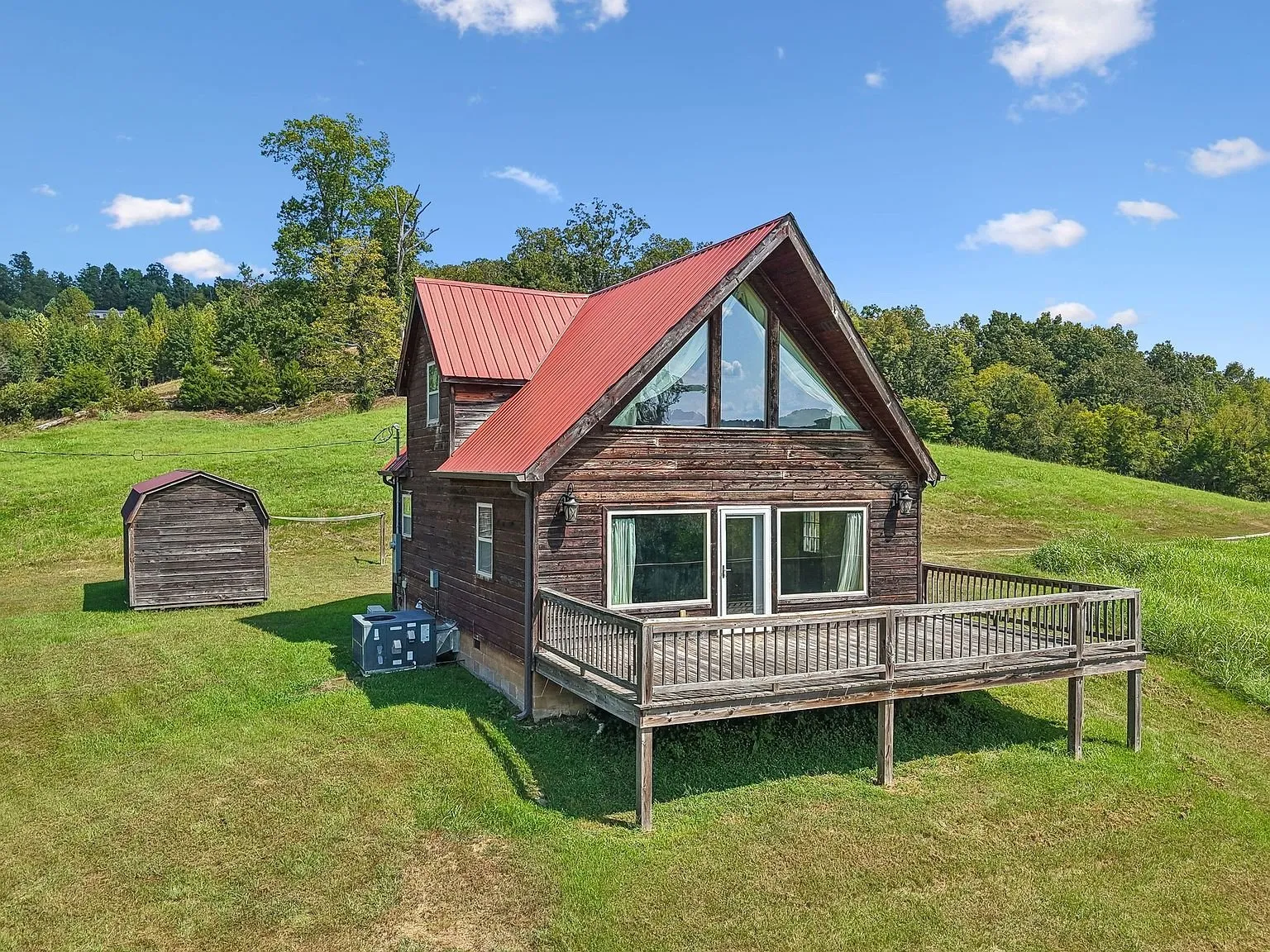 The A-frame and the shed from above with the deck and the mini-split units