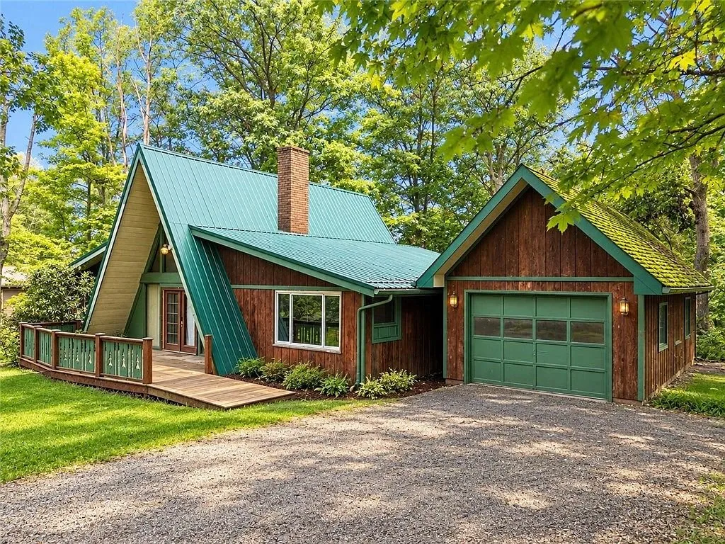 The A-frame and attached garage from the front lawn