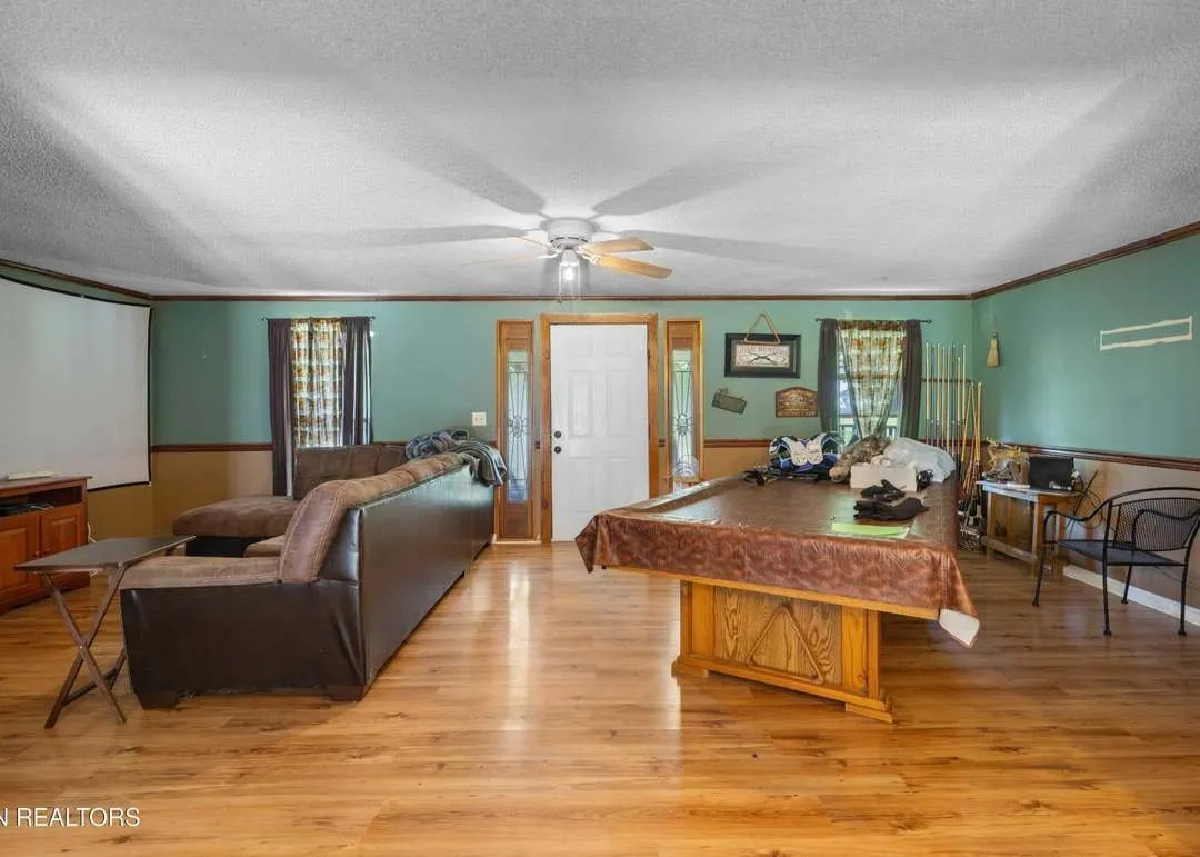A wood-accented living room with a sectional sofa