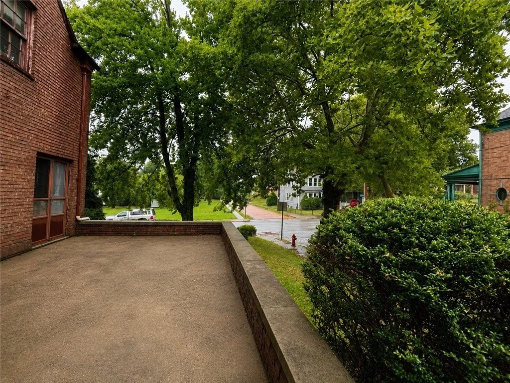 The concrete drive and the corner from the garage apron