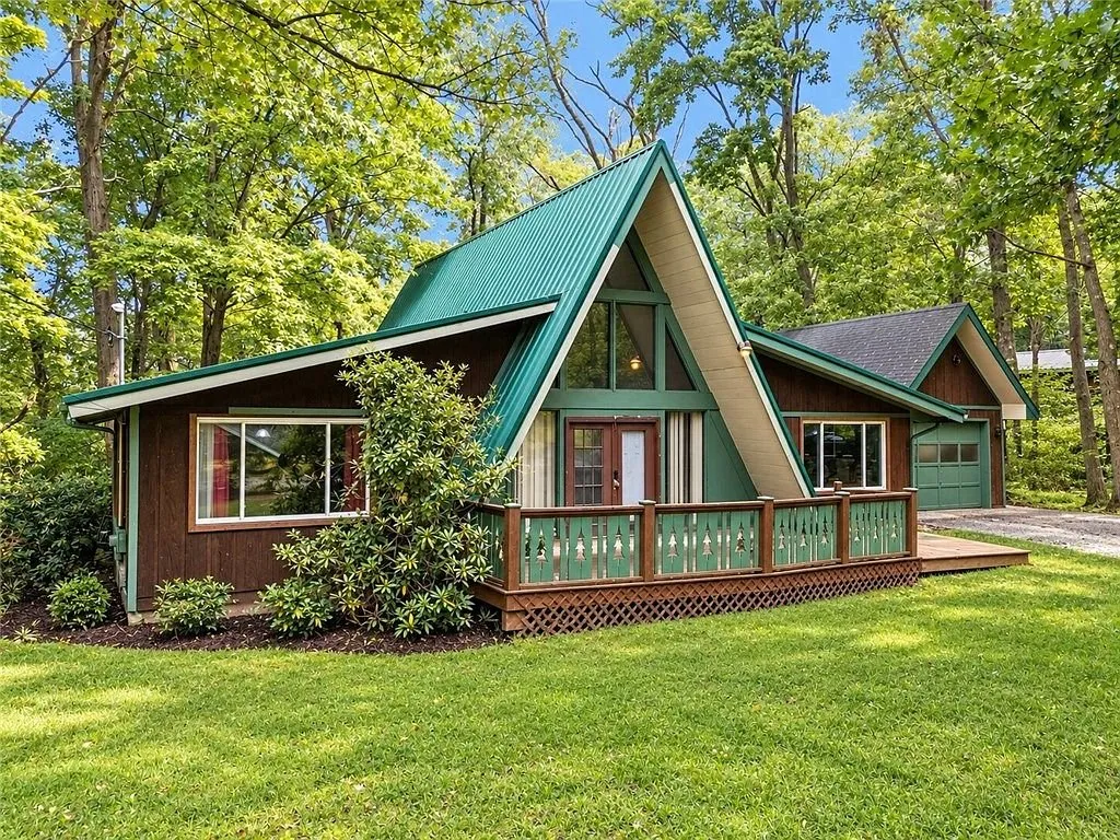 The A-frame's peak and chimney from the side yard