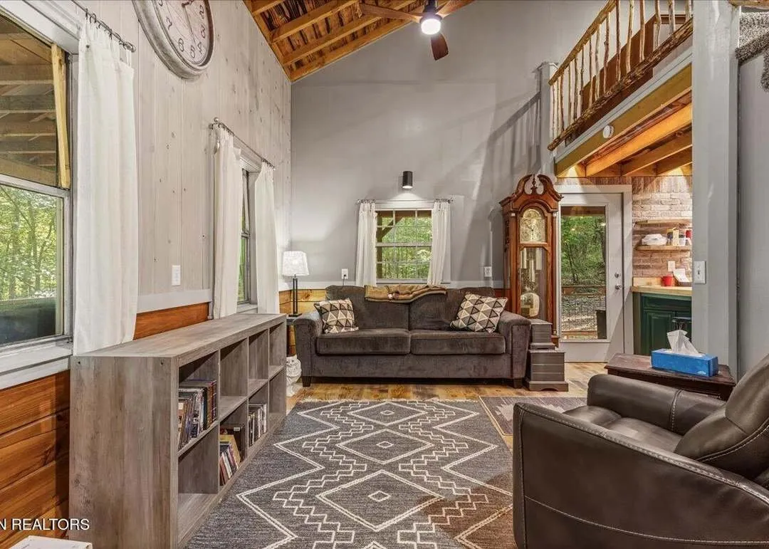 The loft bedroom overlooking the living room below