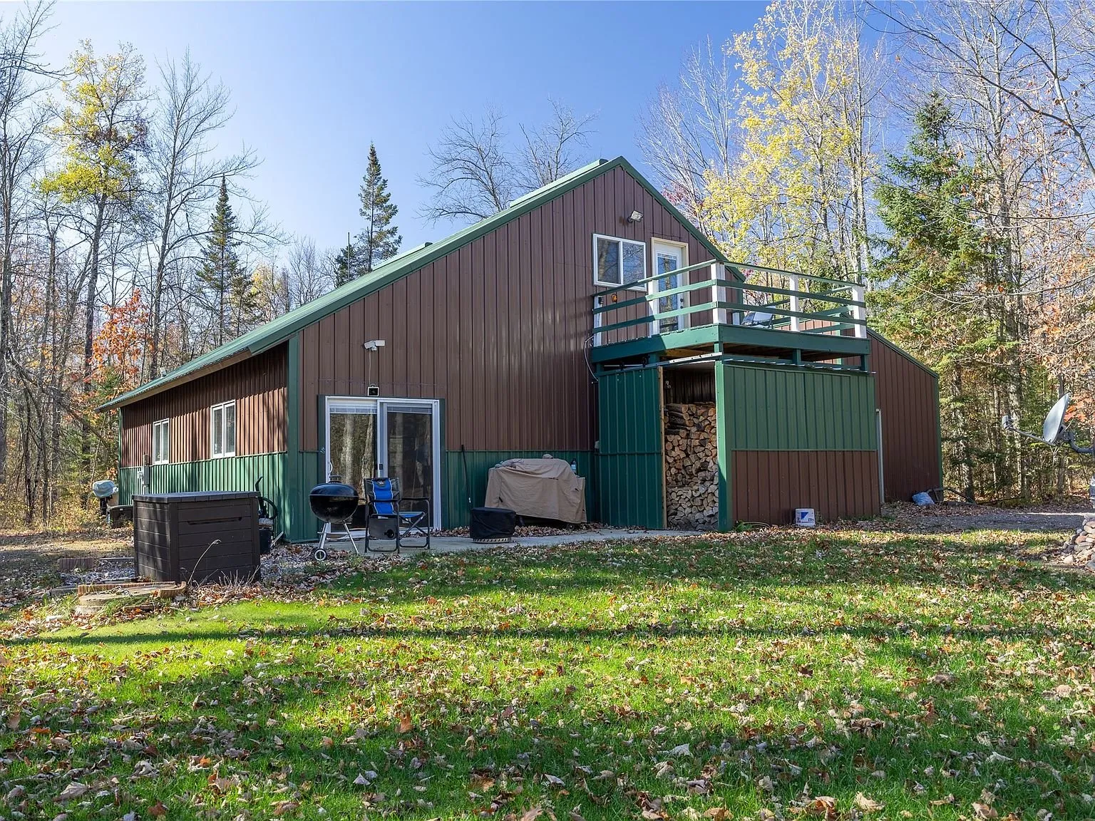 The home and open lawn seen from across the cleared yard