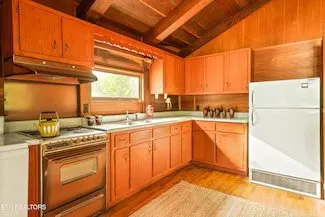 A second kitchen angle showing the counters and overhead cabinetry