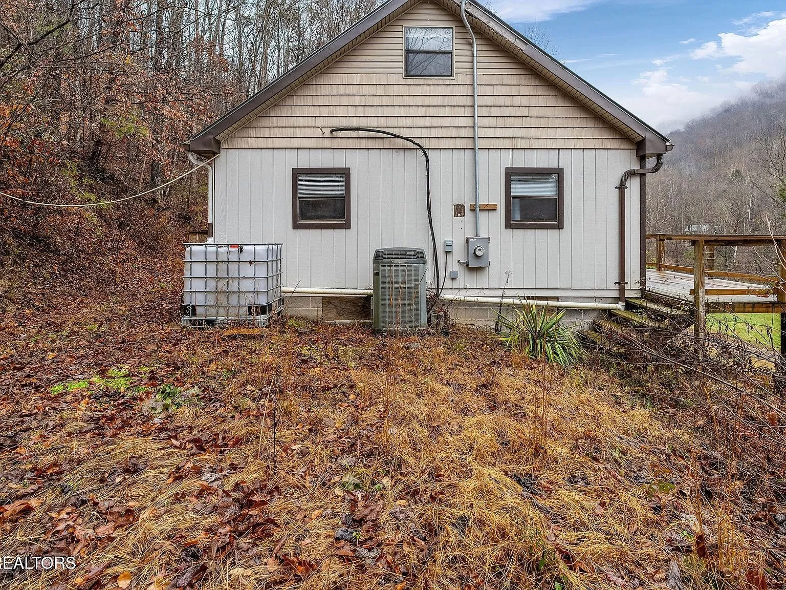 The home's upper deck and stairway built into the hillside
