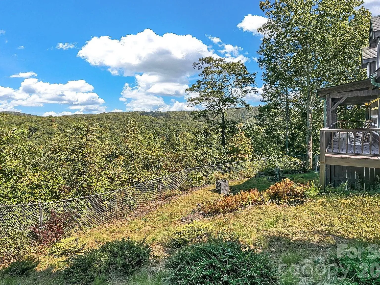 A long-range view of wooded mountains from the property