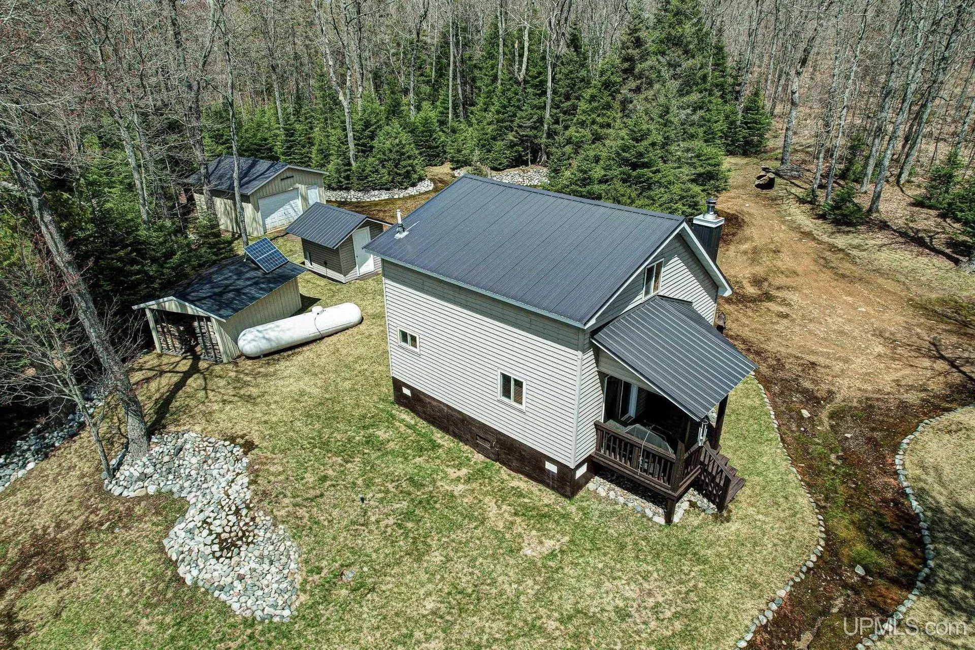 Aerial of the cabin and the garage with the propane tank between them