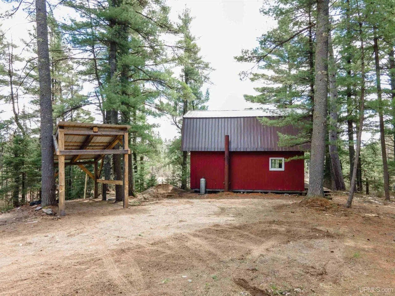 The back of the camp from the cleared drive