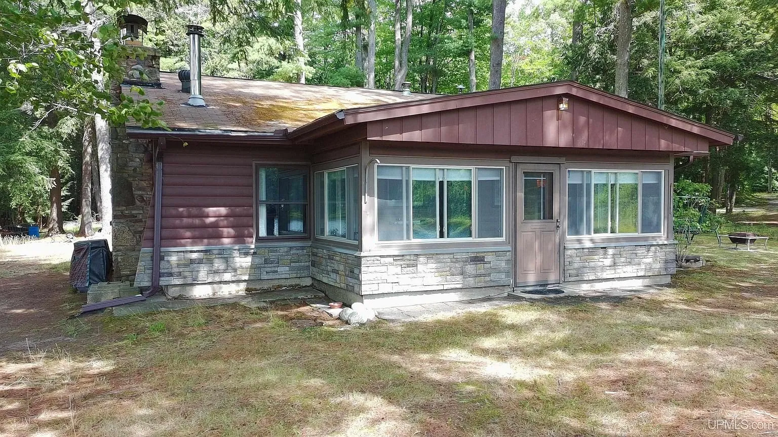 The three-season room end of the cabin with its bank of windows