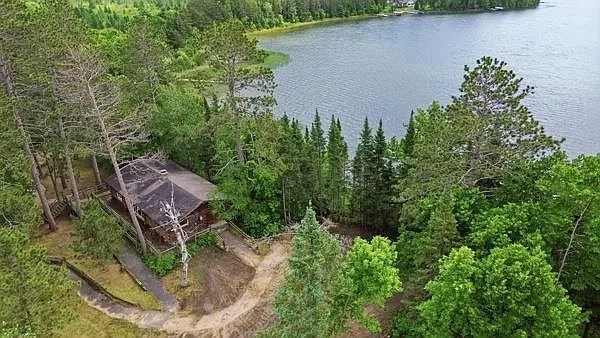 The cabins and the shore from the air with the lake beyond