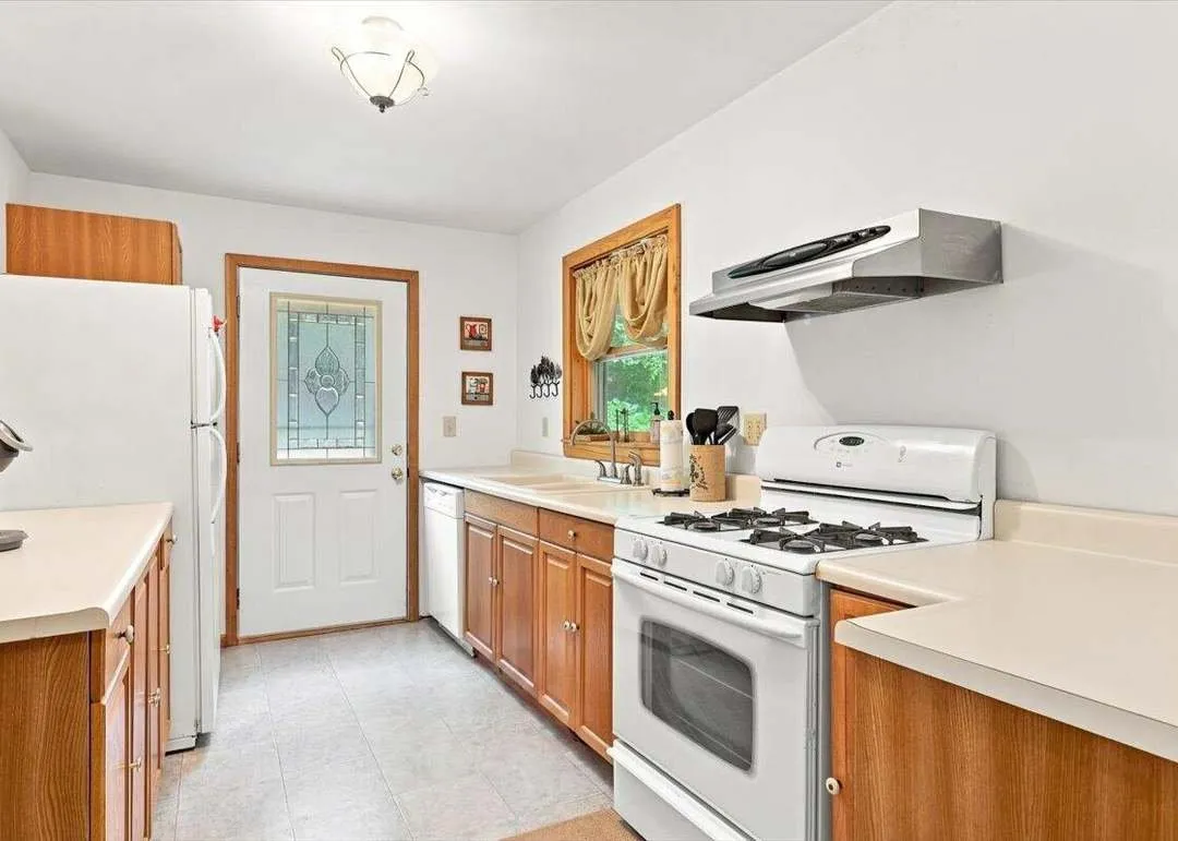The main-level kitchen with wood cabinets and a work island