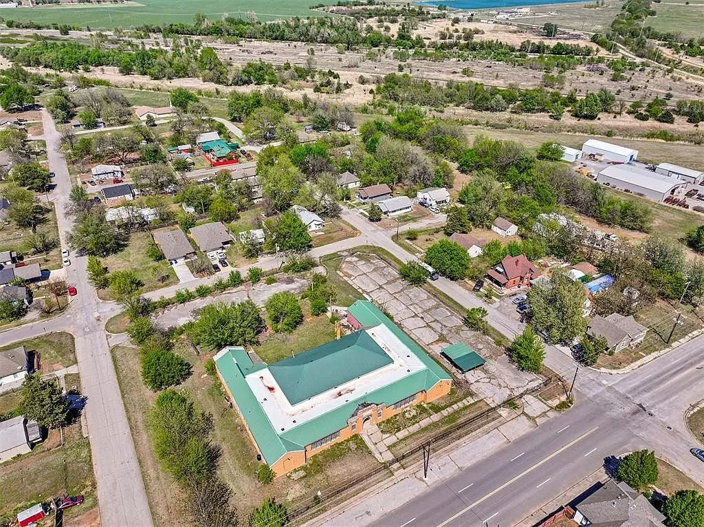 The U-shaped roof from the air with the concrete play yard behind