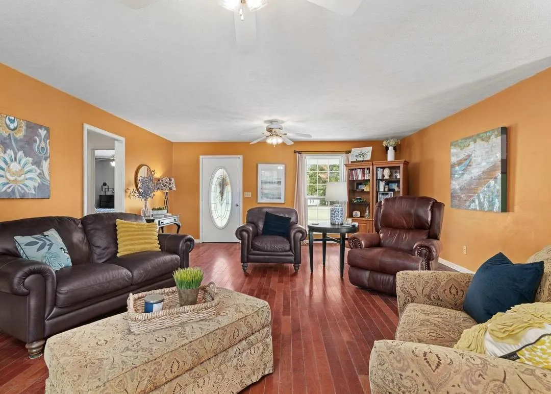 The kitchen with wood cabinets and tile flooring