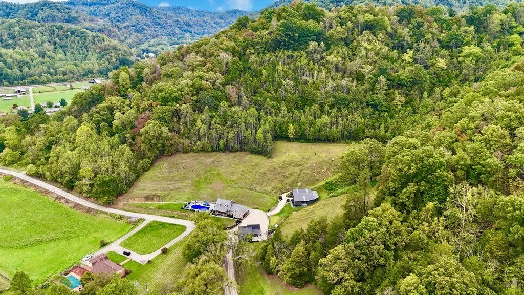 Aerial of the valley with the drive winding in from the road
