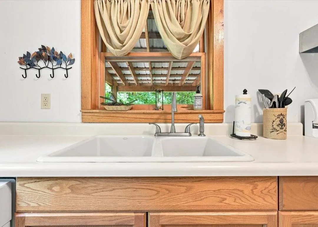 The kitchen counter and cabinets seen from the dining side