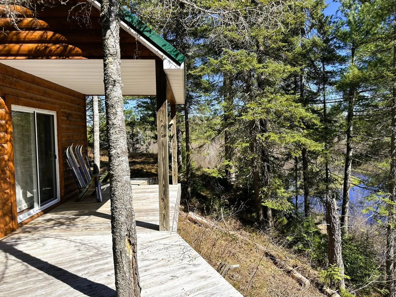 The covered entry and steps at the side of the cabin