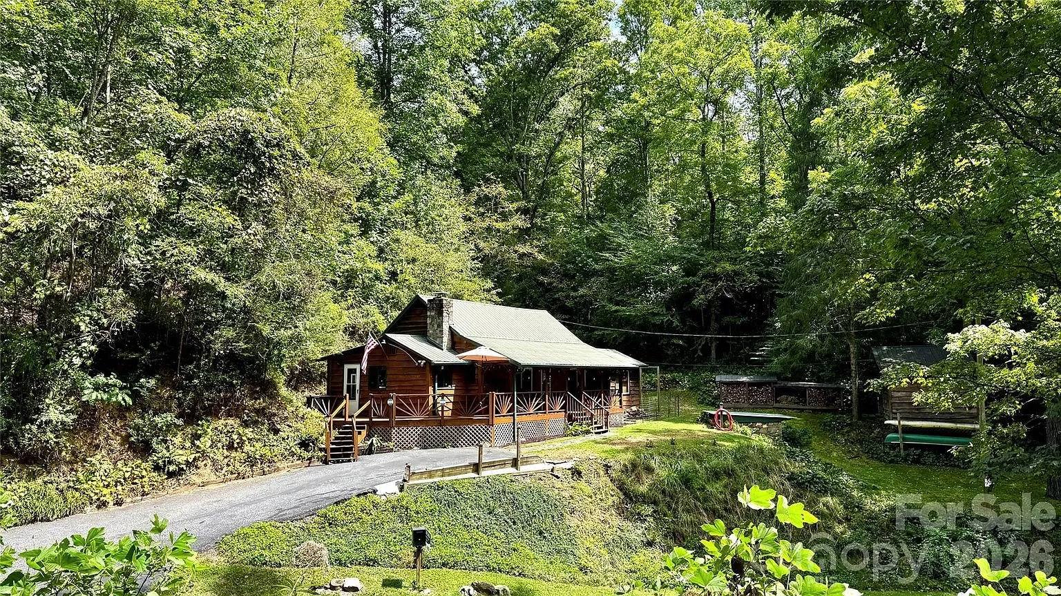 The cottage and the outbuilding from across the road