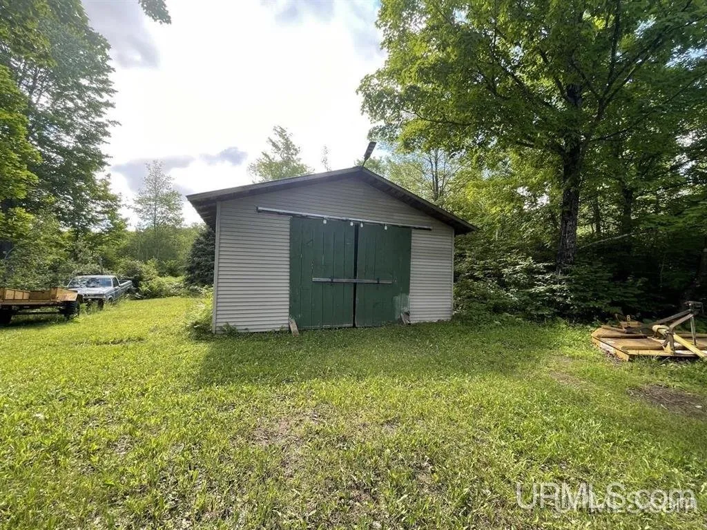 The pole barn with its green double doors