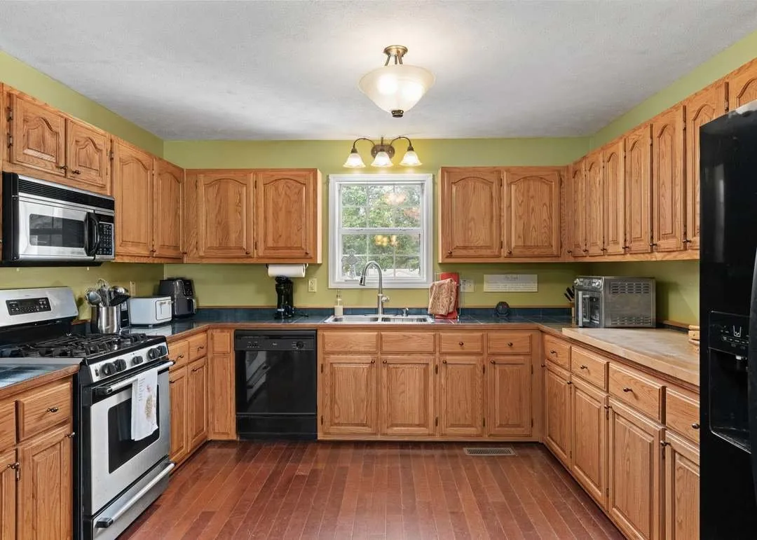 The dining area with hardwood floors and natural light