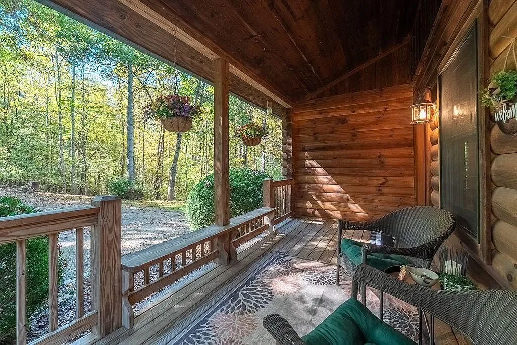 Hanging flower baskets along the covered porch railing