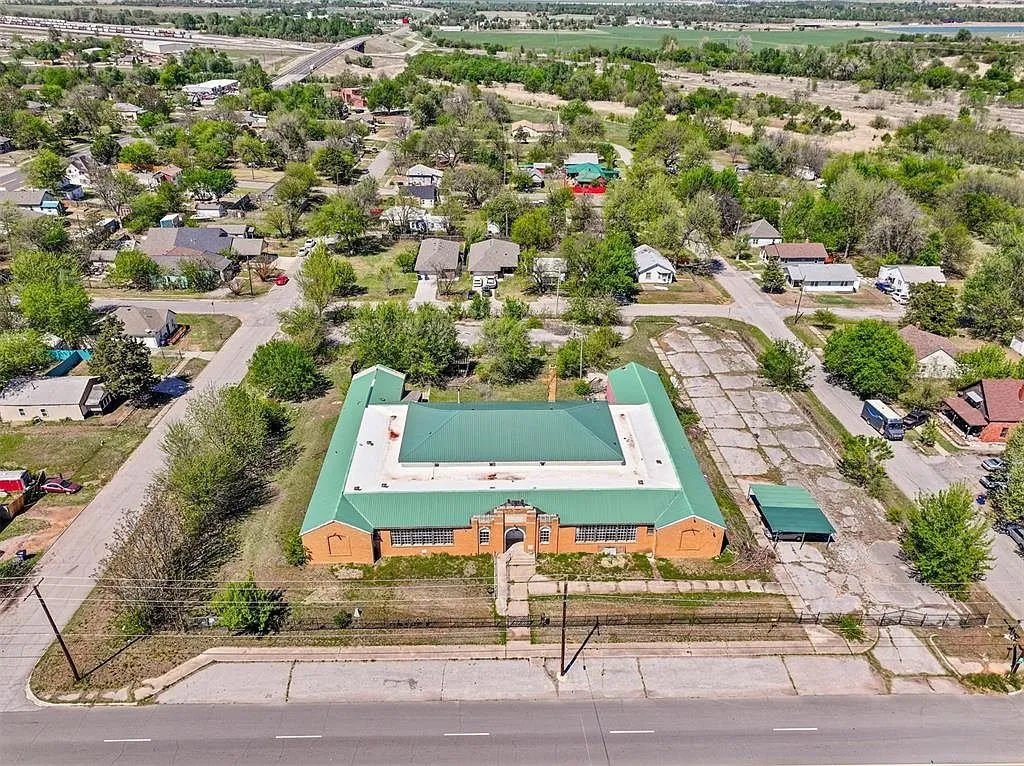 The school from the air over the street with the houses beyond