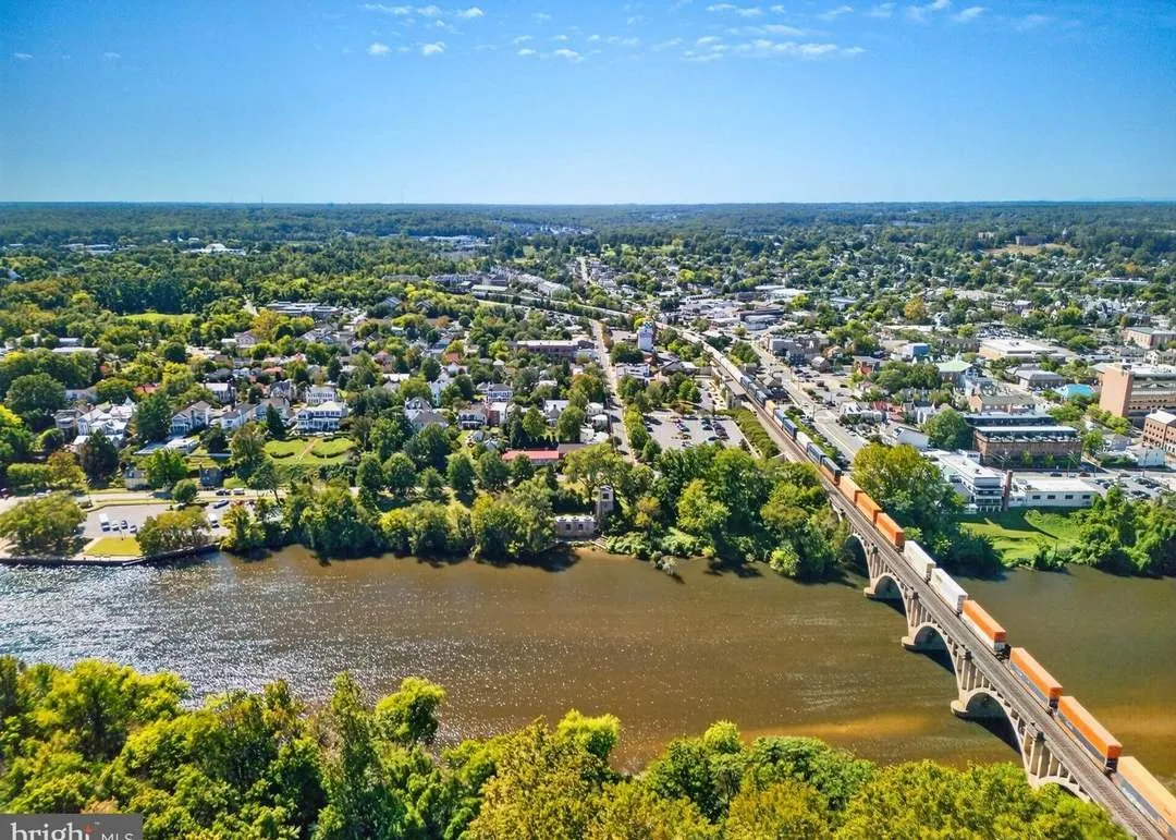 A wide aerial view of Fredericksburg along the river