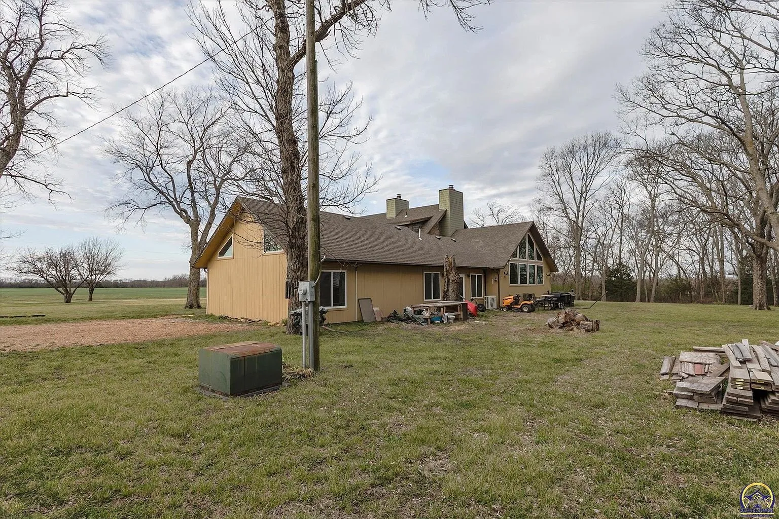 The addition from the side yard with the trees along the line