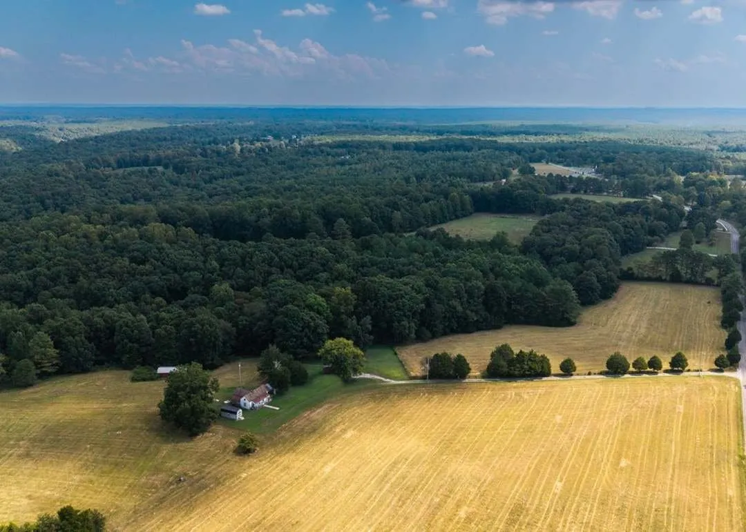Aerial view of the property's rolling farmland stretching toward the horizon