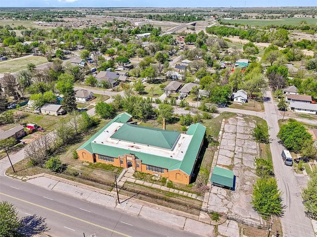 The block from the air with the school on its corner