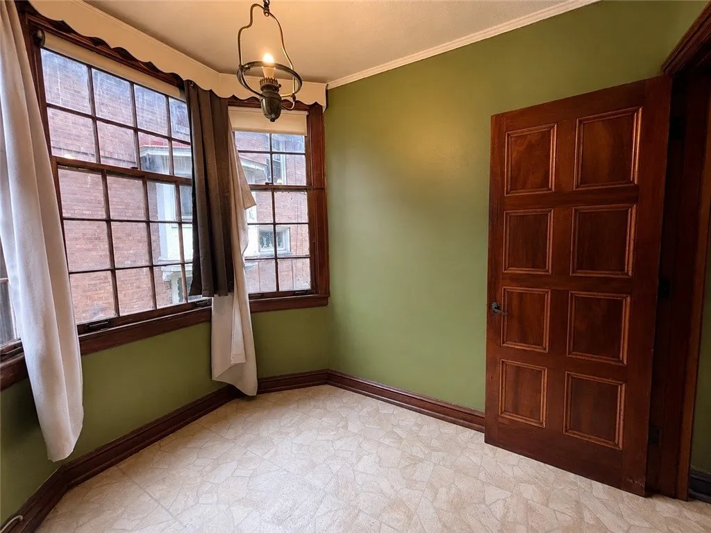 The sunroom windows and the door to the hall