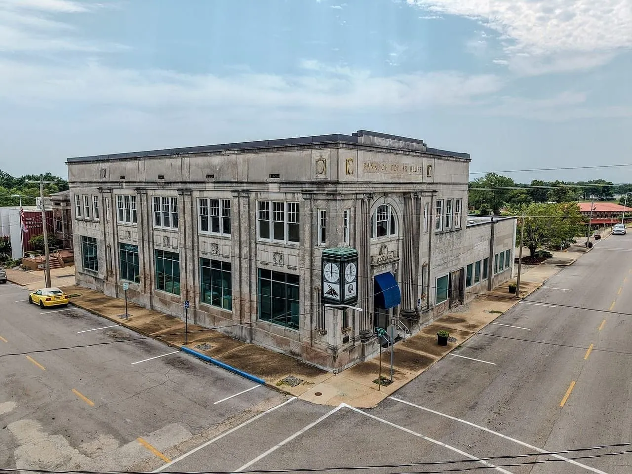 Aerial of the building from the north with the cars on Main Street below