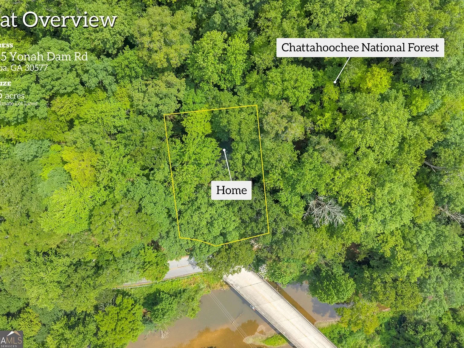 A second wide aerial overview showing the river bend near the property