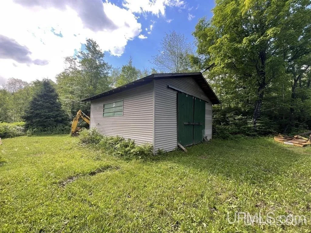 The pole barn from the side on the slope