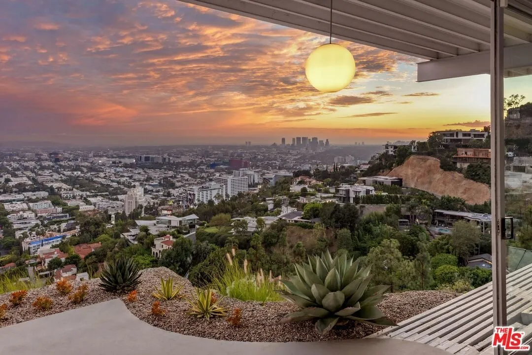 Daylight view over the hillside and the city from the terrace edge