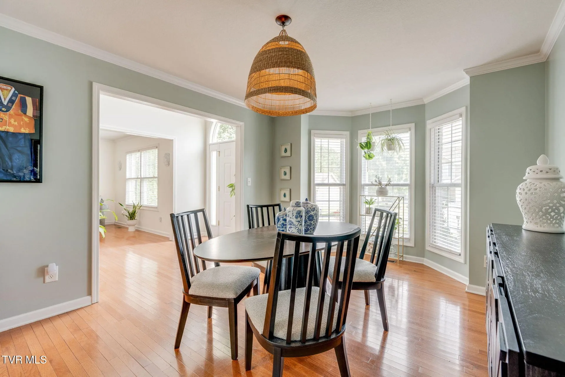 The dining room from the kitchen doorway with the sideboard and mirror