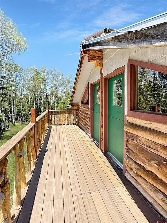 The upper deck along the rail toward the door