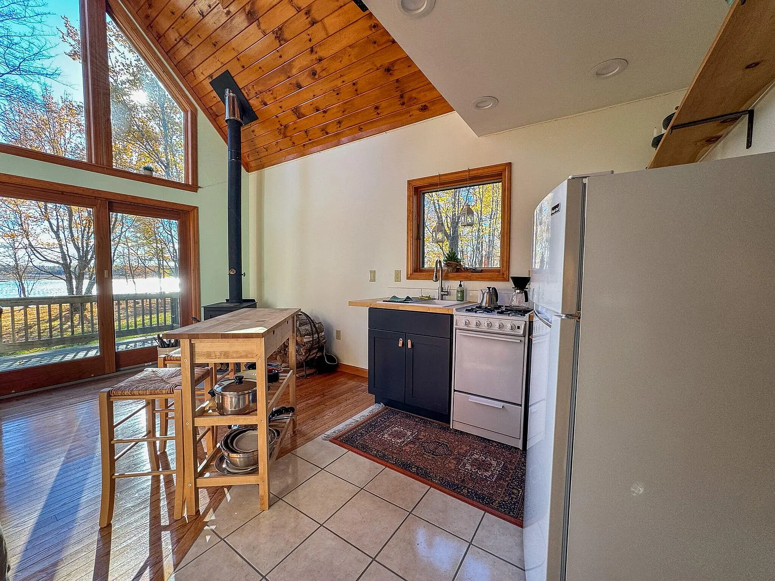 The kitchen and dining area seen from above, with the loft ladder and skylights visible