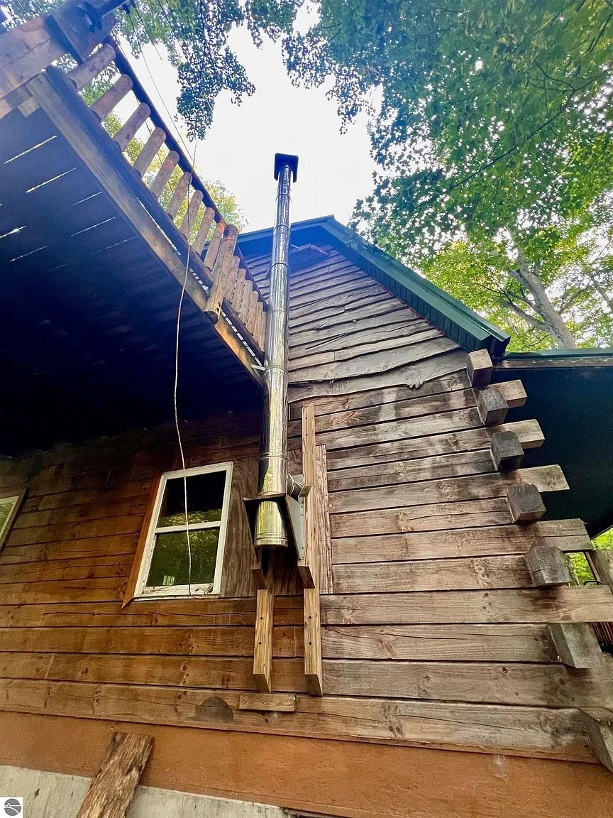 The balcony from below with the stove pipe through the roof