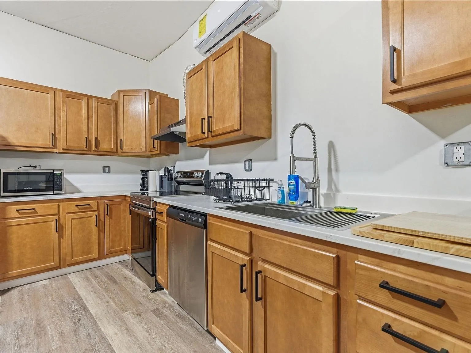 The kitchen and laundry area together along one wall