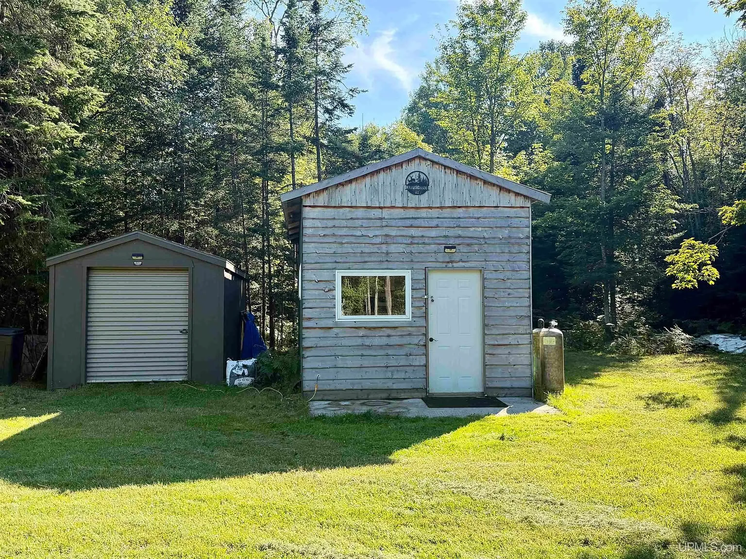 The base camp and the shed from the mowed yard