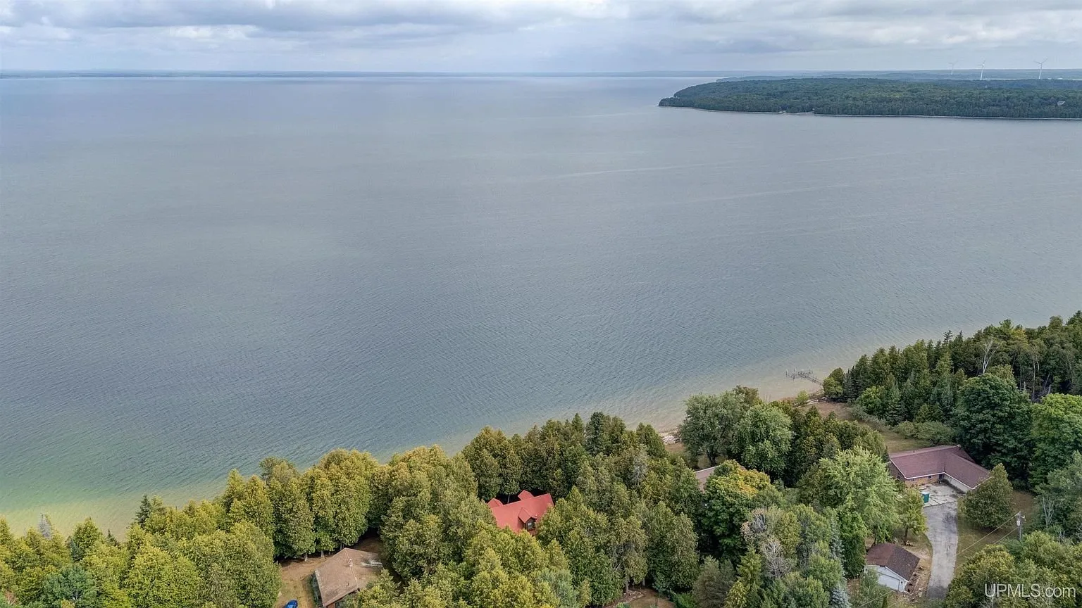 Lake Michigan from above with the wooded shore below