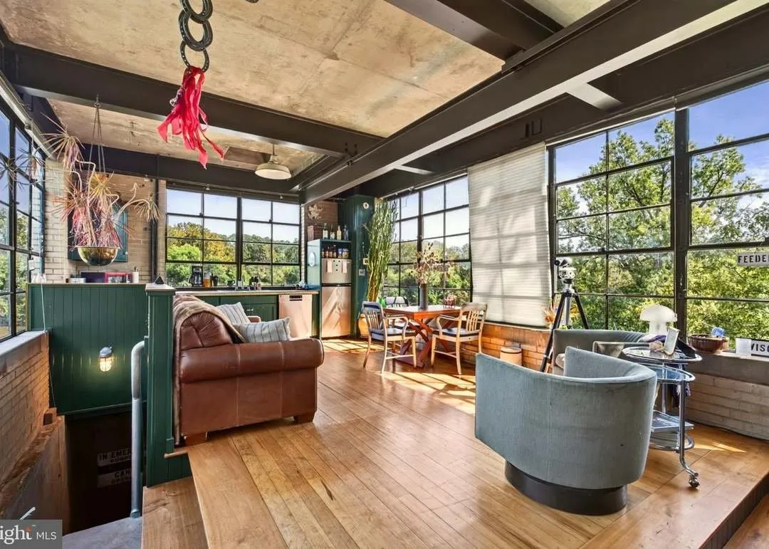 The main living area with leather seating and panoramic windows on three sides