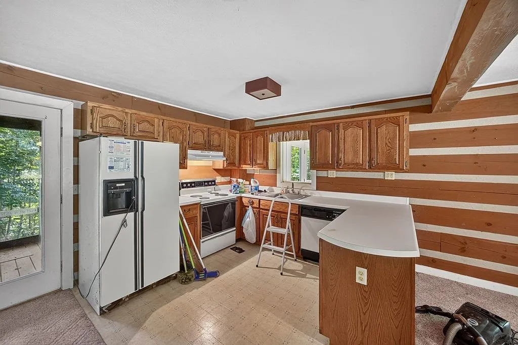 The kitchen counter and cabinets seen from the dining side