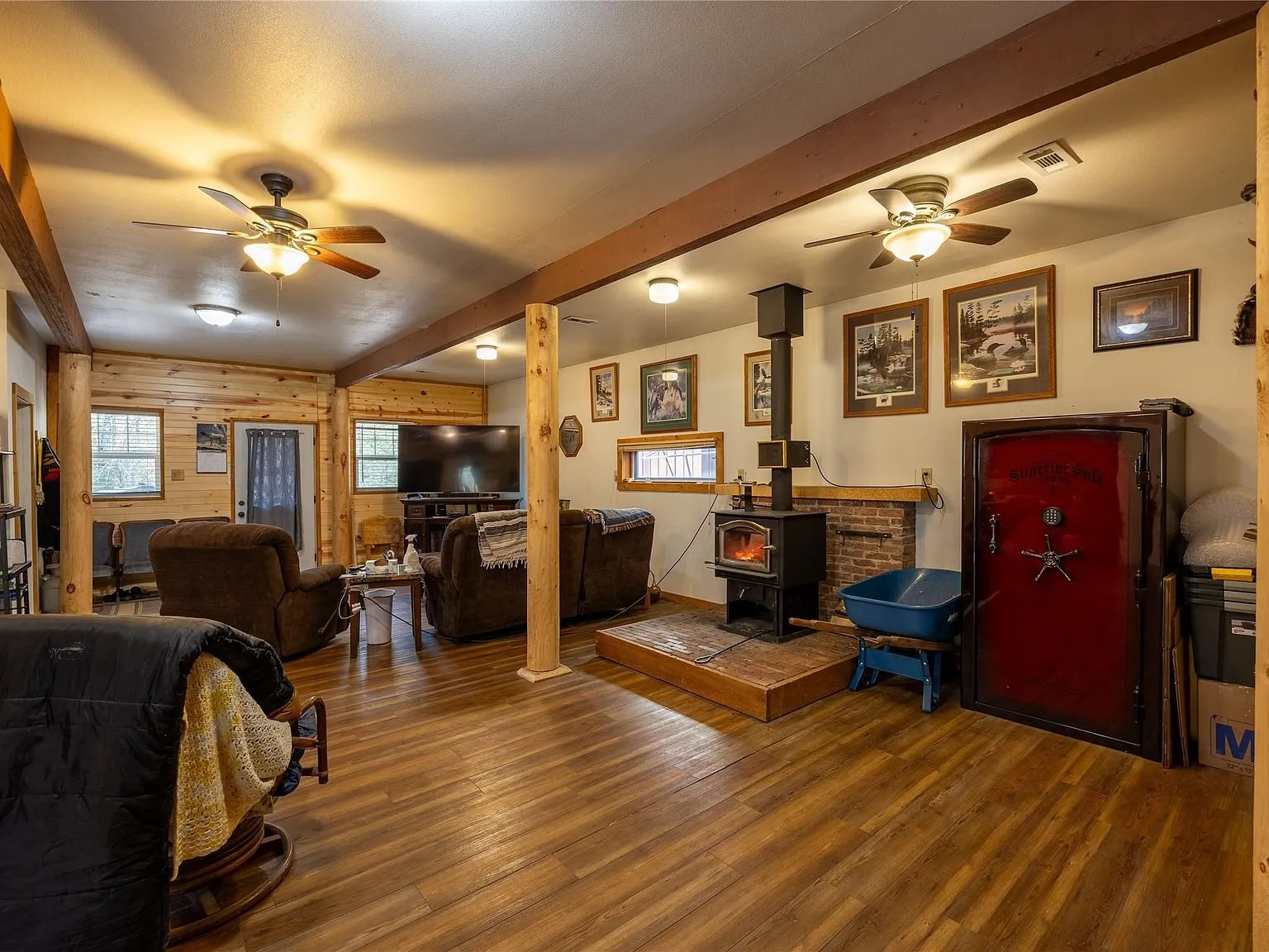 The living room with leather recliners facing a mounted television