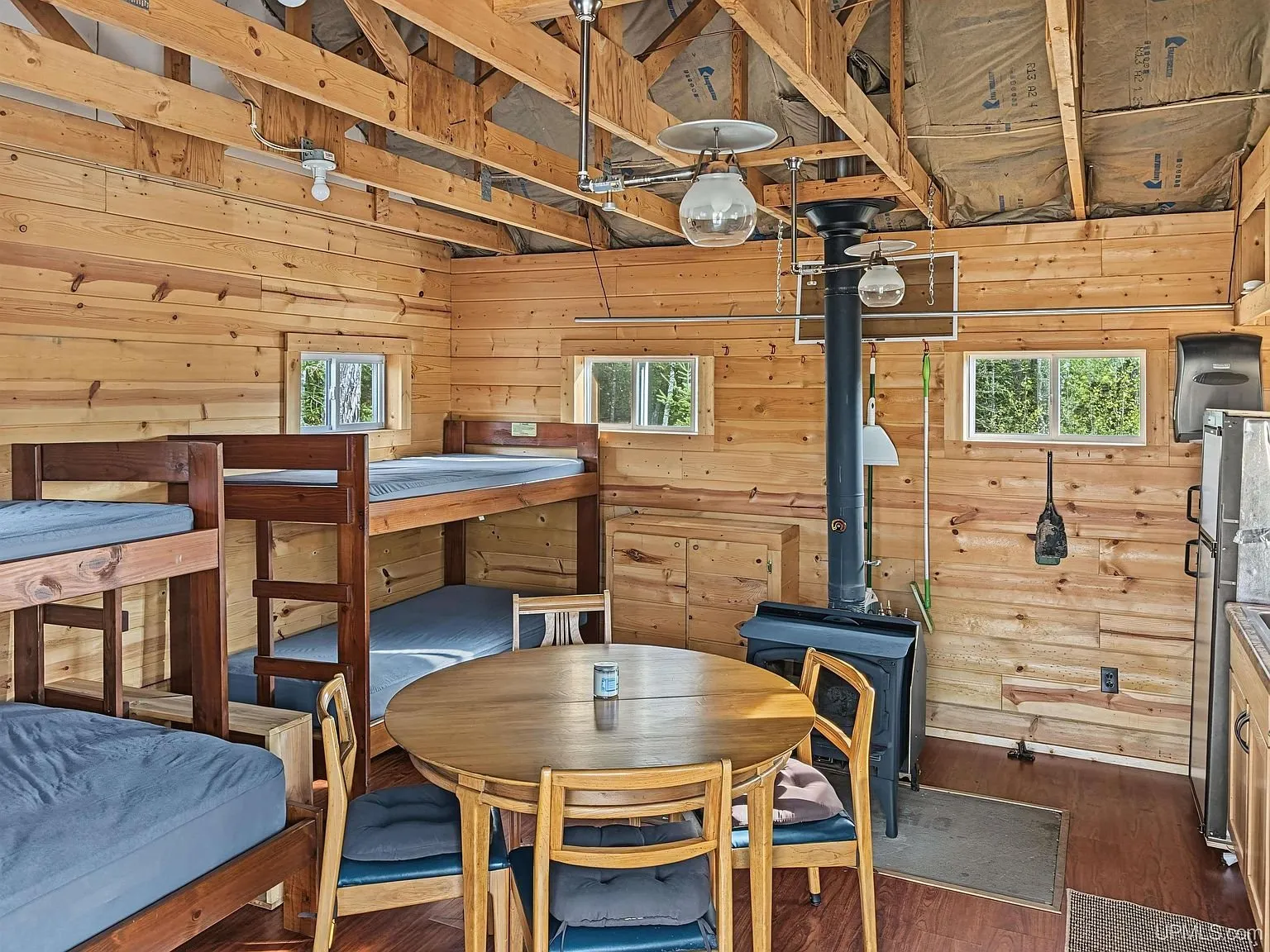 The wood stove, refrigerator and kitchen counter together