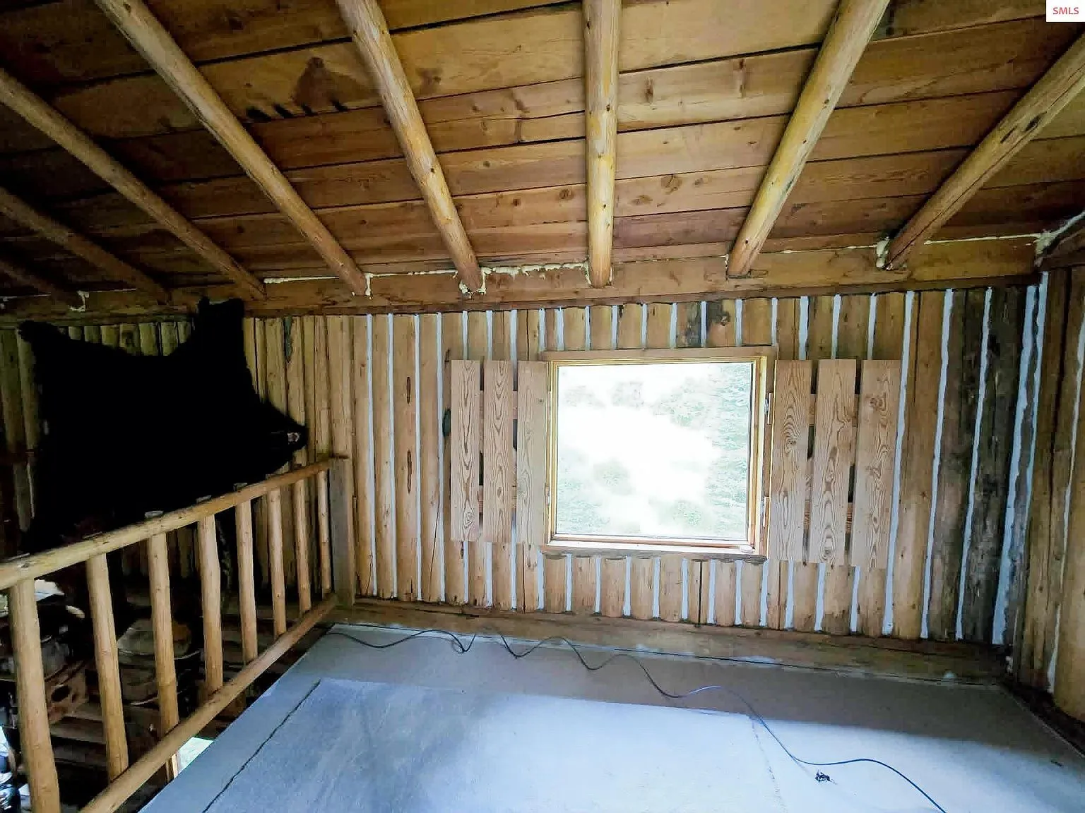 The open loft railing overlooking the living room below