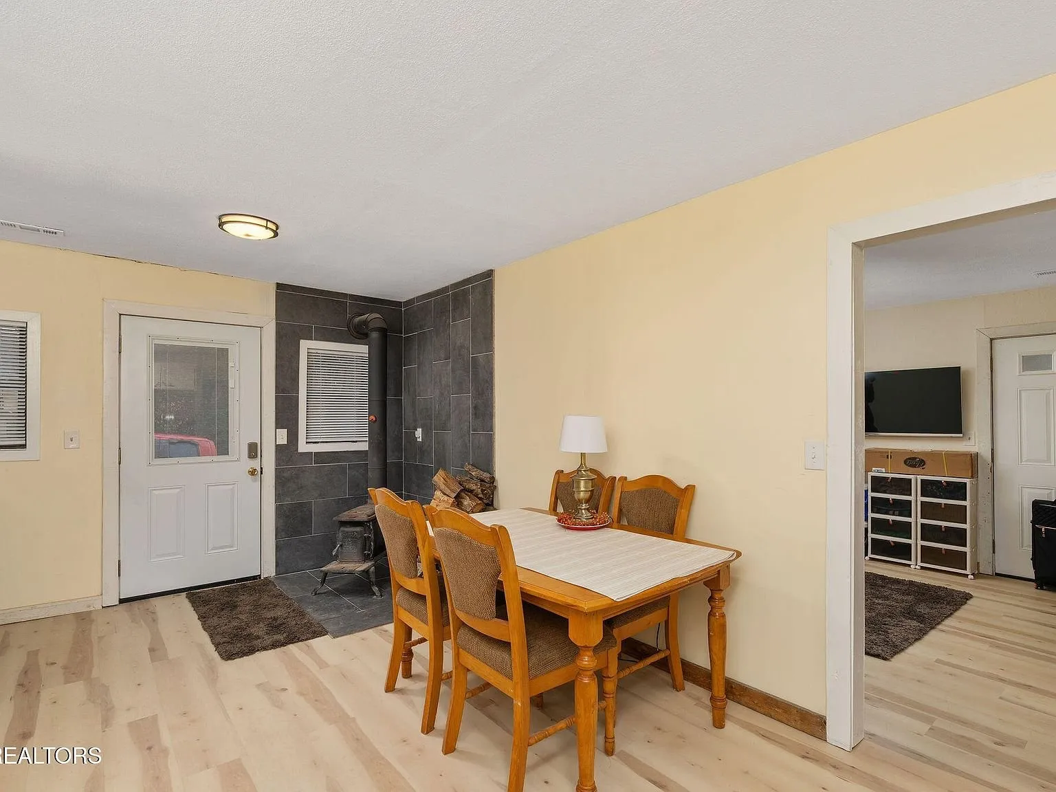 The dining table and chairs in the kitchen's eating area