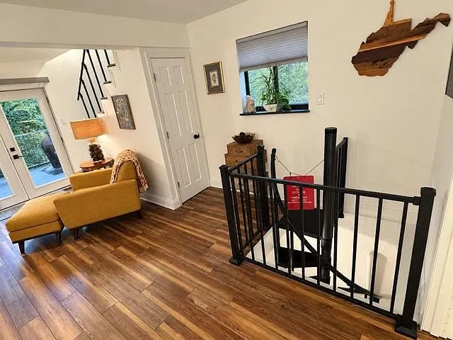 The bonus room's daybed with a quilted cover, tucked beneath the sloped ceiling